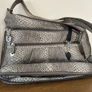 Travelon bag, expandable sides and base. Muted shade 13” by 12”